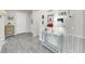 Entryway with wood-look floors, light-colored walls, and console table at 10842 Rolling Moss Rd, Tampa, FL 33647