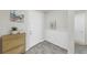 Entryway with wood-look floors, light-colored walls, cabinet and wall decor at 10842 Rolling Moss Rd, Tampa, FL 33647