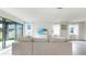 Bright living room with a comfortable sofa, large glass doors, and plenty of natural light at 10842 Rolling Moss Rd, Tampa, FL 33647