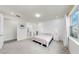 Relaxing main bedroom with light-colored carpet and a window to allow for natural light at 10842 Rolling Moss Rd, Tampa, FL 33647