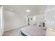 Comfortable main bedroom featuring ensuite bathroom access and carpet flooring at 10842 Rolling Moss Rd, Tampa, FL 33647