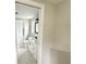 Bathroom with tile floors, modern vanity and sink, toilet, and natural lighting at 10914 Oakdale Ave, Port Richey, FL 34668