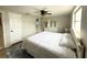 Bedroom with a comfortable bed, ceiling fan, and ample natural light from the window at 10914 Oakdale Ave, Port Richey, FL 34668