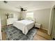 Spacious bedroom featuring a plush rug, full sized bed, and ambient lighting at 10914 Oakdale Ave, Port Richey, FL 34668