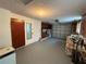 Garage featuring storage and access to the backyard at 10914 Oakdale Ave, Port Richey, FL 34668