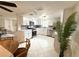 Modern kitchen with white cabinetry, stainless steel appliances, tiled backsplash, and lots of natural light at 10914 Oakdale Ave, Port Richey, FL 34668