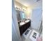 Bathroom with double sink vanity, granite countertop, and decorative 