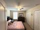 Comfortable bedroom with ample closet space, a ceiling fan, and neutral decor, perfect for restful nights at 11309 Villas On The Green Dr, Riverview, FL 33579