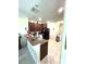 Efficient kitchen featuring dark wood cabinets, modern appliances, and a convenient breakfast bar for casual dining at 11309 Villas On The Green Dr, Riverview, FL 33579