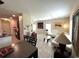 Open-concept living area with a dining table, kitchen, and comfortable seating, perfect for gatherings and everyday living at 11309 Villas On The Green Dr, Riverview, FL 33579