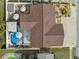 Aerial view of the property showcasing the layout, pool, patio, shed, and landscaping at 11422 Brown Bear Ln, Port Richey, FL 34668