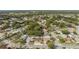 Overhead shot features residential neighborhood with lush trees and homes nestled along tree-lined streets at 11422 Brown Bear Ln, Port Richey, FL 34668