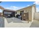 The backyard features a concrete patio, outdoor shower, and screened porch, creating an ideal outdoor living space at 11422 Brown Bear Ln, Port Richey, FL 34668