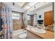 Cozy bathroom with shower-tub combination and decorative sea-themed accents at 11422 Brown Bear Ln, Port Richey, FL 34668
