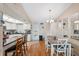 Bright kitchen and dining area with modern appliances and ample counter space at 11422 Brown Bear Ln, Port Richey, FL 34668