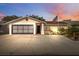 Charming single-story home with a two-car garage and well-manicured landscaping at 11422 Brown Bear Ln, Port Richey, FL 34668