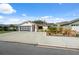 Charming single-story home with a two-car garage and spacious concrete driveway at 11422 Brown Bear Ln, Port Richey, FL 34668