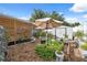 Backyard garden area with raised beds, perfect for gardening enthusiasts and outdoor activities at 11422 Brown Bear Ln, Port Richey, FL 34668