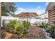 Backyard garden area with raised beds, providing an opportunity for gardening and outdoor enjoyment at 11422 Brown Bear Ln, Port Richey, FL 34668