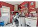 Functional laundry room with washer, dryer, and utility sink at 11422 Brown Bear Ln, Port Richey, FL 34668