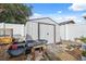 Backyard featuring a storage shed and planter boxes, offering practical storage and gardening options at 11422 Brown Bear Ln, Port Richey, FL 34668