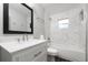 Bathroom featuring a marble sink vanity, mirror, toilet, and a shower/tub at 123 Jeffrey Dr, Brandon, FL 33511