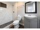 Updated bathroom featuring a walk-in shower with decorative tile and a stylish vanity with modern fixtures at 123 Jeffrey Dr, Brandon, FL 33511