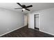 Bedroom with grey walls, hardwood floors, a closet, and ceiling fan at 123 Jeffrey Dr, Brandon, FL 33511