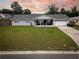 Charming single story home featuring manicured lawn, stone details, attached garage, and a covered front porch at 123 Jeffrey Dr, Brandon, FL 33511