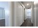Long hallway featuring laminate flooring and closet space leading to living area and bedrooms at 123 Jeffrey Dr, Brandon, FL 33511