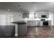 Beautiful kitchen featuring stainless appliances, gray cabinetry, and a breakfast bar perfect for modern living at 123 Jeffrey Dr, Brandon, FL 33511