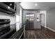 Modern kitchen featuring stainless steel appliances, sleek countertops, and stylish gray cabinetry, perfect for cooking at 123 Jeffrey Dr, Brandon, FL 33511