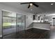 Bright living room with sliding glass doors, leading to the backyard with a pool view, adjacent to the kitchen at 123 Jeffrey Dr, Brandon, FL 33511