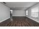 Spacious living room featuring hardwood floors, fresh paint, recessed lighting, and lots of natural light at 123 Jeffrey Dr, Brandon, FL 33511
