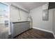 Utility room featuring gray cabinets, a water heater, and hardwood floors at 123 Jeffrey Dr, Brandon, FL 33511