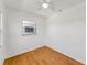 Cozy bedroom with ceiling fan, wood floors and a window for natural light at 12400 Park Blvd # 311, Seminole, FL 33772