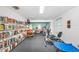 Bright community room featuring a library, gym equipment, and plenty of natural light at 12400 Park Blvd # 311, Seminole, FL 33772