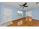 Cozy living area featuring hardwood floors, a ceiling fan, and light blue walls at 12400 Park Blvd # 311, Seminole, FL 33772