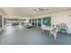 Spacious patio with several tables and chairs for entertaining at 12400 Park Blvd # 311, Seminole, FL 33772