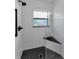 Walk in shower features glass door, window and bench at 12400 Park Blvd # 311, Seminole, FL 33772