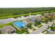 Beautiful aerial view of colorful homes next to a pond and trail at 13334 Palmera Vista Dr, Riverview, FL 33579