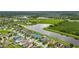 An aerial view of a neighborhood with lake views and community amenities at 13334 Palmera Vista Dr, Riverview, FL 33579