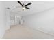 This cozy room has neutral carpet, light walls, and a modern ceiling fan at 13334 Palmera Vista Dr, Riverview, FL 33579