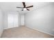 This bedroom includes neutral walls, carpeted floors, and a large closet at 13334 Palmera Vista Dr, Riverview, FL 33579