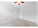 Cozy bedroom featuring plush carpet, a ceiling fan, and a closet for easy storage solutions at 13334 Palmera Vista Dr, Riverview, FL 33579
