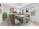 Elegant dining room featuring stylish decor, a modern table, and ample natural light from the window at 13334 Palmera Vista Dr, Riverview, FL 33579