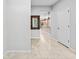 Entryway featuring tile flooring, an ornate mirror, and access to the kitchen at 13334 Palmera Vista Dr, Riverview, FL 33579