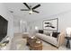 Cozy living room featuring comfortable seating, stylish decor, and a ceiling fan at 13334 Palmera Vista Dr, Riverview, FL 33579
