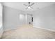 Bright living room featuring tile flooring, neutral walls, and a ceiling fan at 13334 Palmera Vista Dr, Riverview, FL 33579