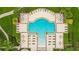 Aerial view of a geometrically shaped community pool with ample seating and lounge areas at 13334 Palmera Vista Dr, Riverview, FL 33579